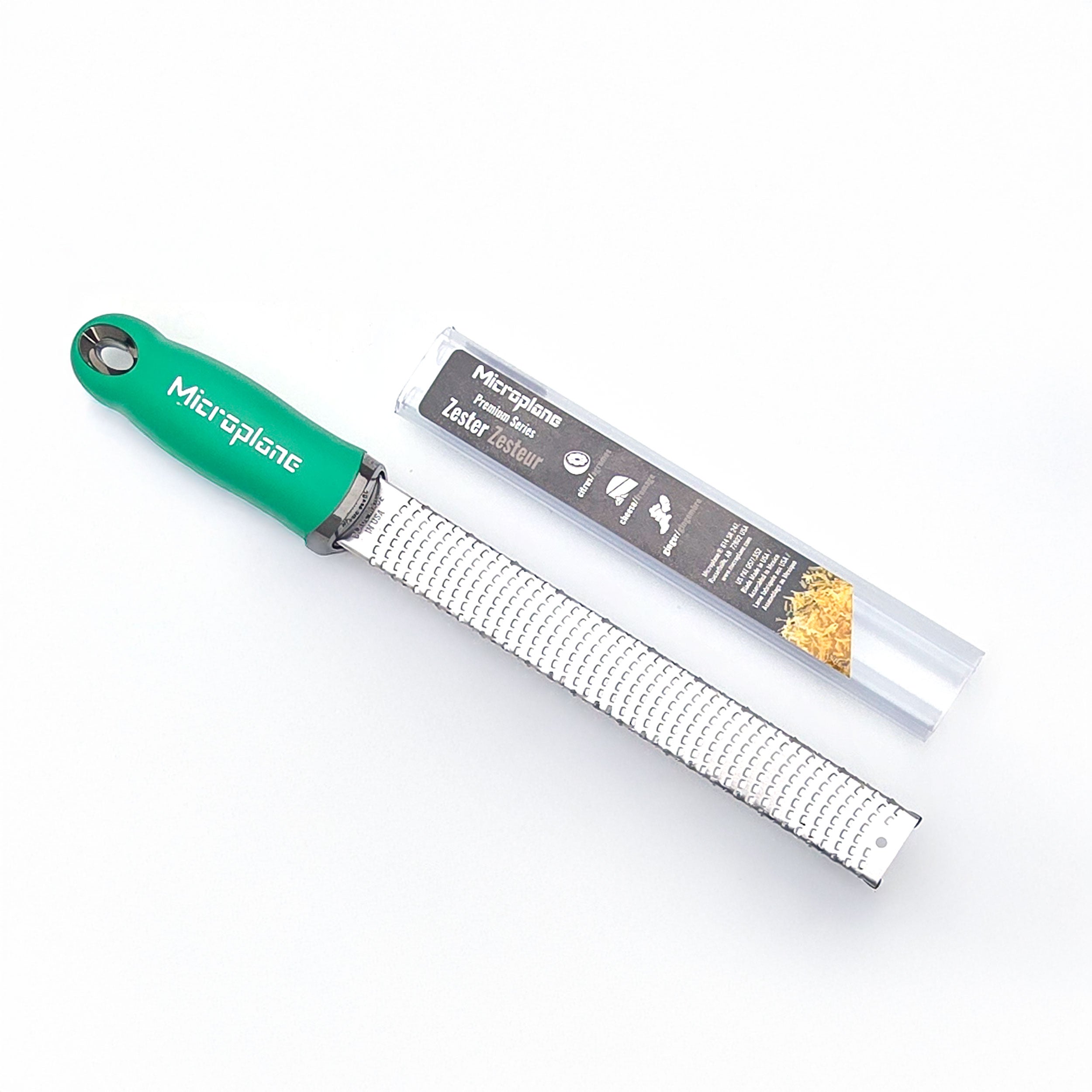 Microplane zester with green handle on a white background